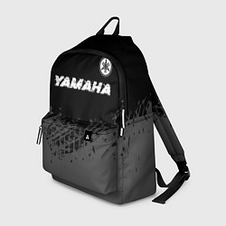 Рюкзак Yamaha speed на темном фоне со следами шин: символ